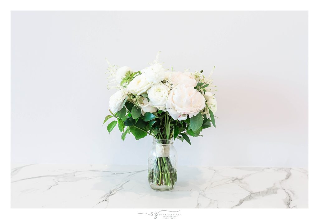 elegant all-white wedding bouquet photographed by Sara Zarella Photography