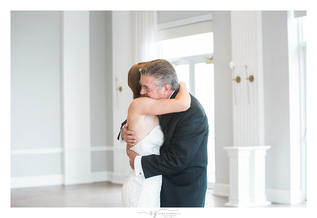 emotional first look with father at Gurney's Resort photographed by Newport RI wedding photographer Sara Zarrella Photography