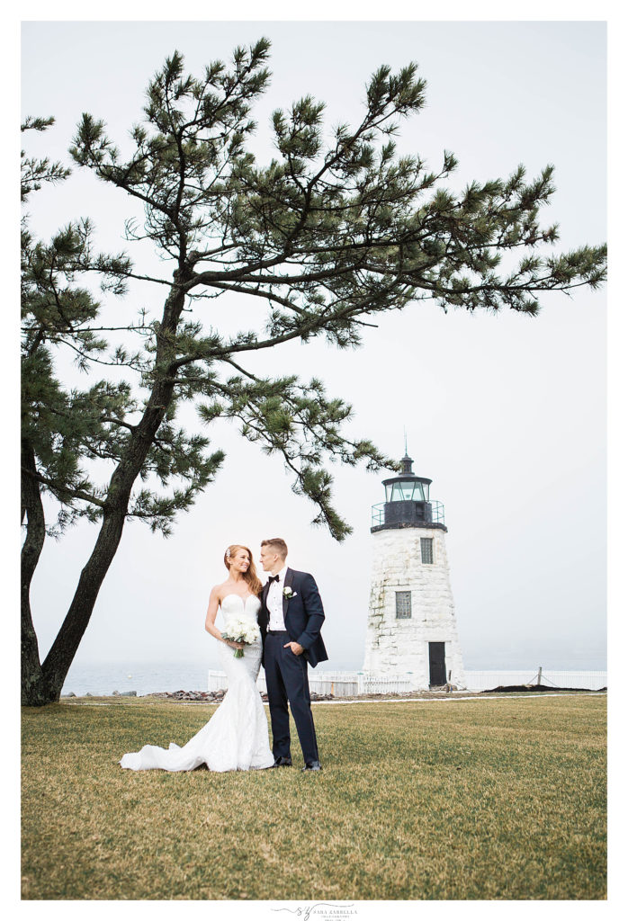 bride and groom photographed near RI lighthouse by Sara Zarrella Photography