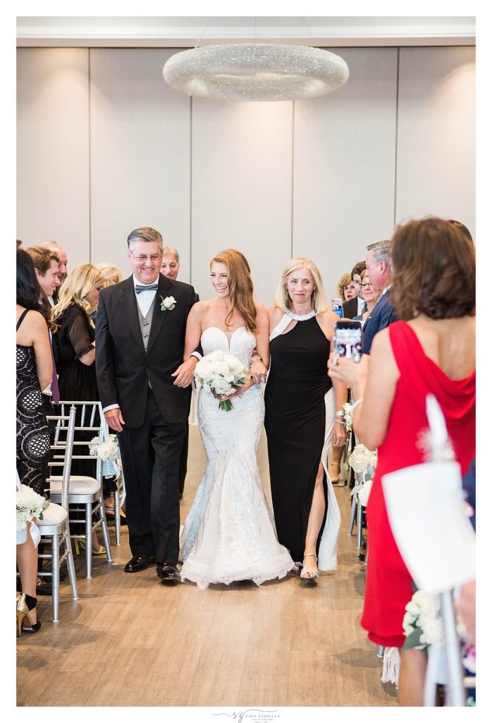 Sara Zarrella Photography photographed bride walking down the aisle with her parents 