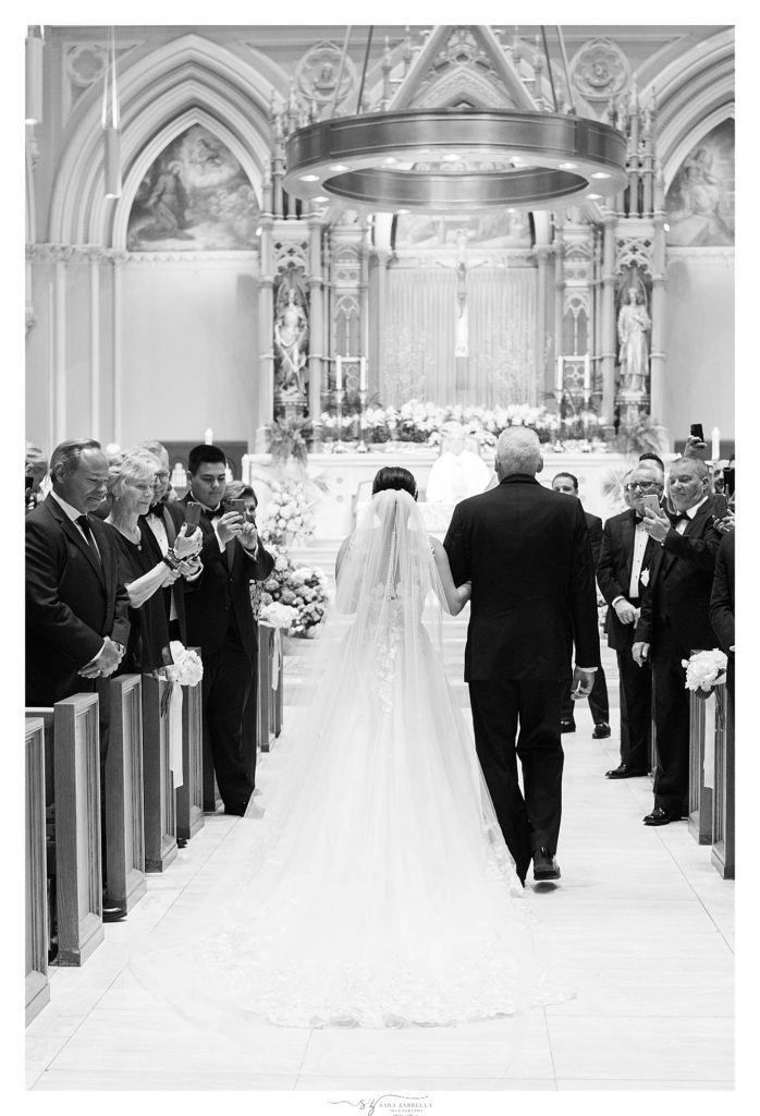 Sara Zarrella Photography photographs bride entering wedding ceremony at the Cathedral of Saints Peter and Paul in Providence RI
