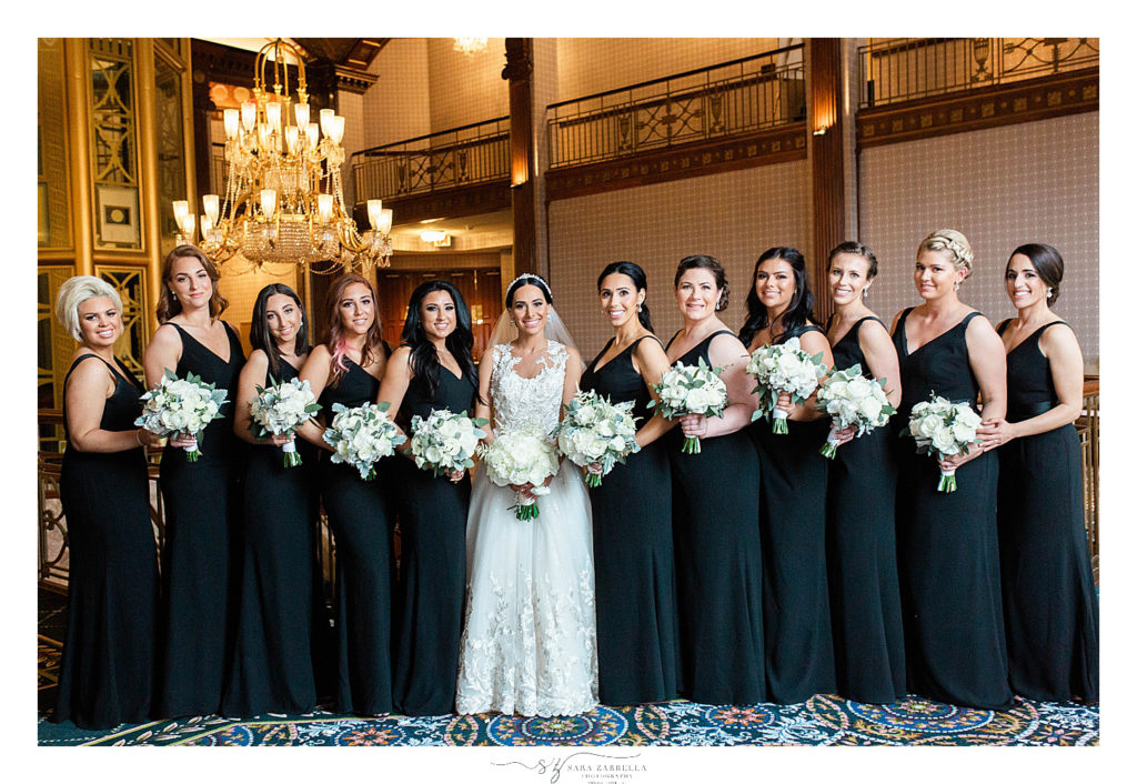 Sara Zarrella Photography photographs bride and bridesmaids in black gowns with ivory bouquets