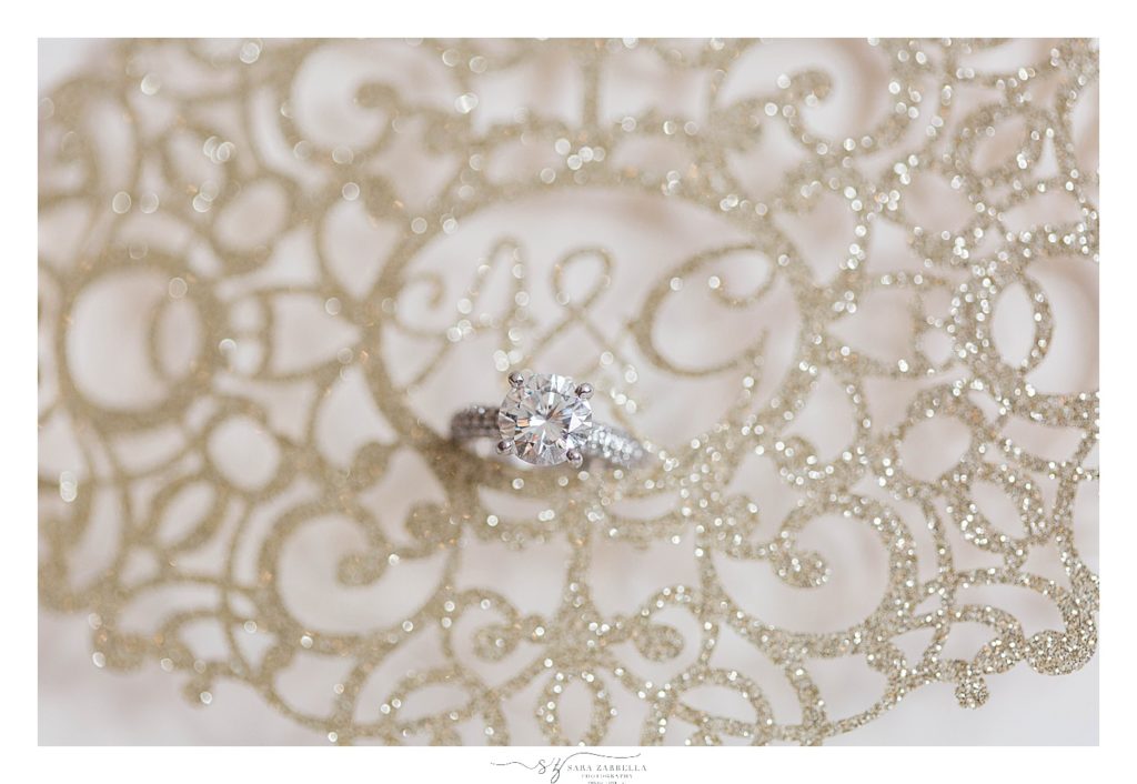 engagement ring on gold invitation suite by Sara Zarrella Photography