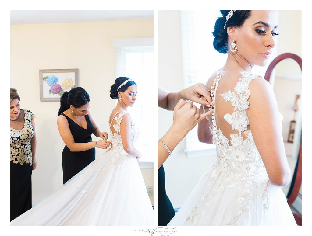 bride gets into lace detailed wedding gown photographed by Sara Zarrella Photography