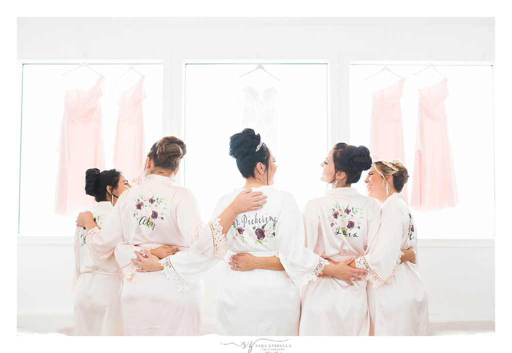 bridesmaids and bride with customized robes photographed by wedding photographer Sara Zarrella Photography