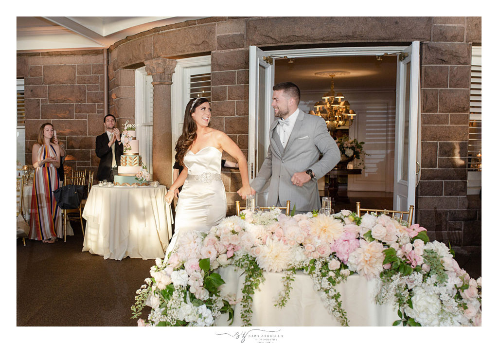 bride and groom enter reception photographed by Sara Zarrella Photography
