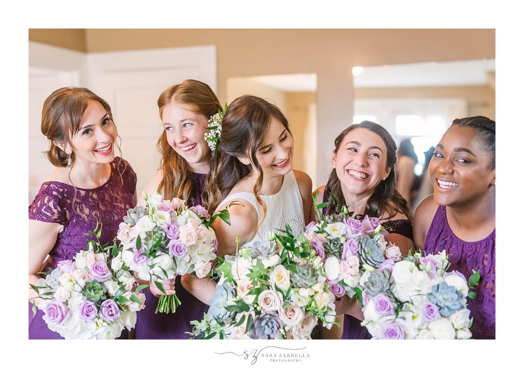 bridesmaids and bride laugh before wedding day in Riverside, RI with Sara Zarrella Photography