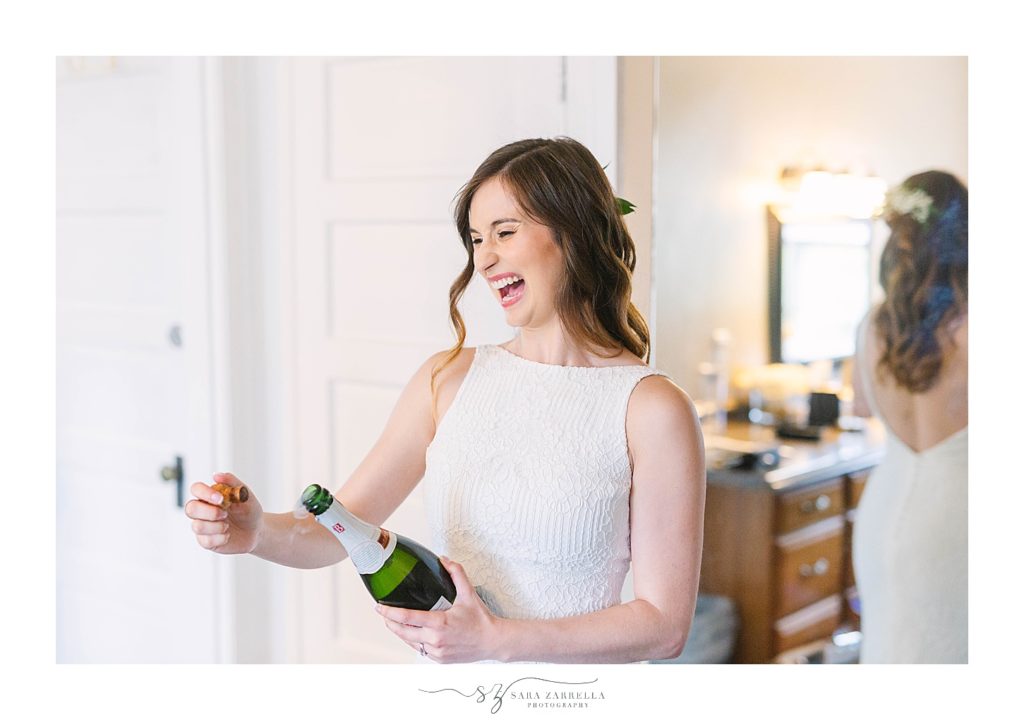 popping champagne before Riverside RI wedding with Sara Zarrella Photography