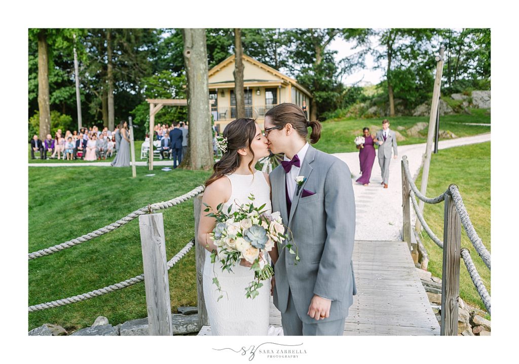 newlyweds kiss at Squantum Association wedding with Sara Zarrella Photography