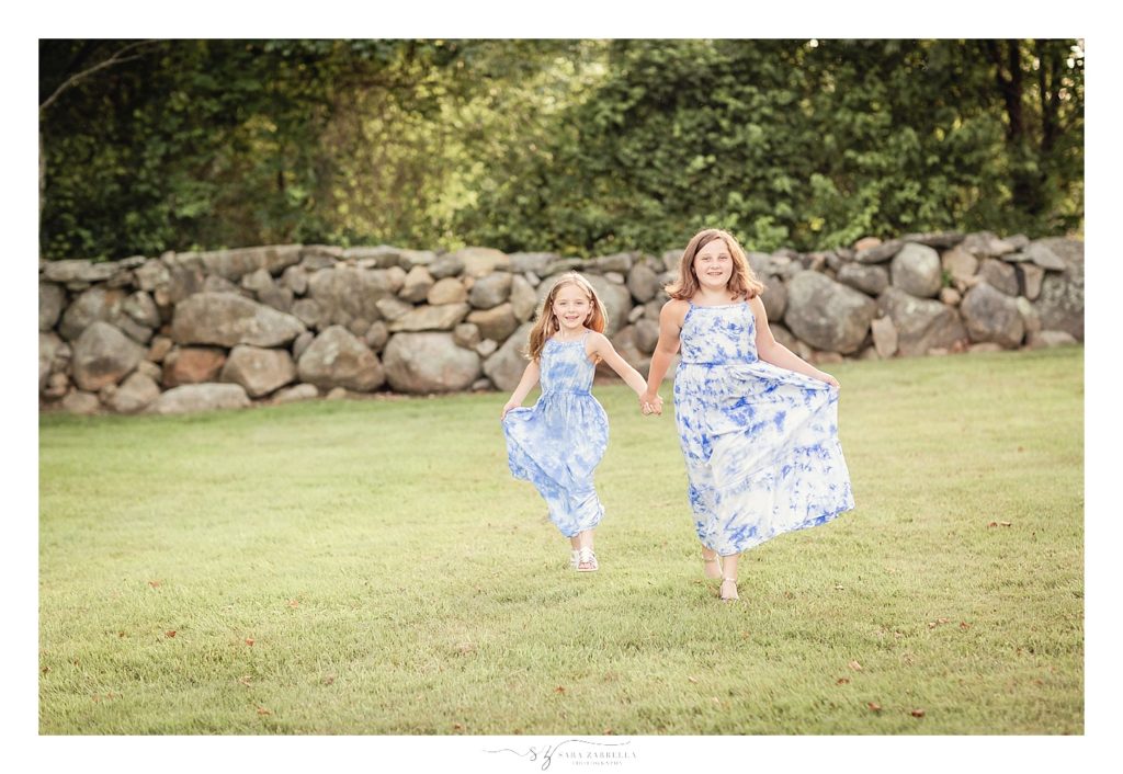 Sara Zarrella Photography photographs sisters playing during family portraits in Rhode Island