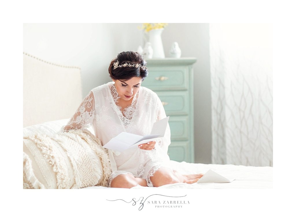 bride reads letter on wedding day photographed by Sara Zarrella Photography