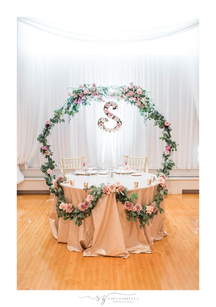 sweetheart table with floral display photographed by Sara Zarrella Photography