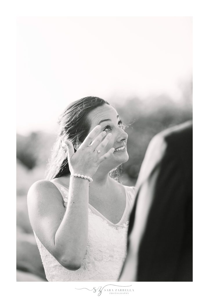 bride cries during wedding ceremony in Rhode Island photographed by Sara Zarrella Photography