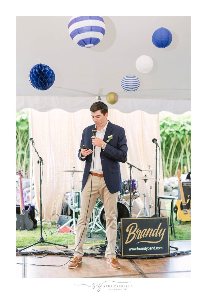 groom gives thank you speech at wedding reception