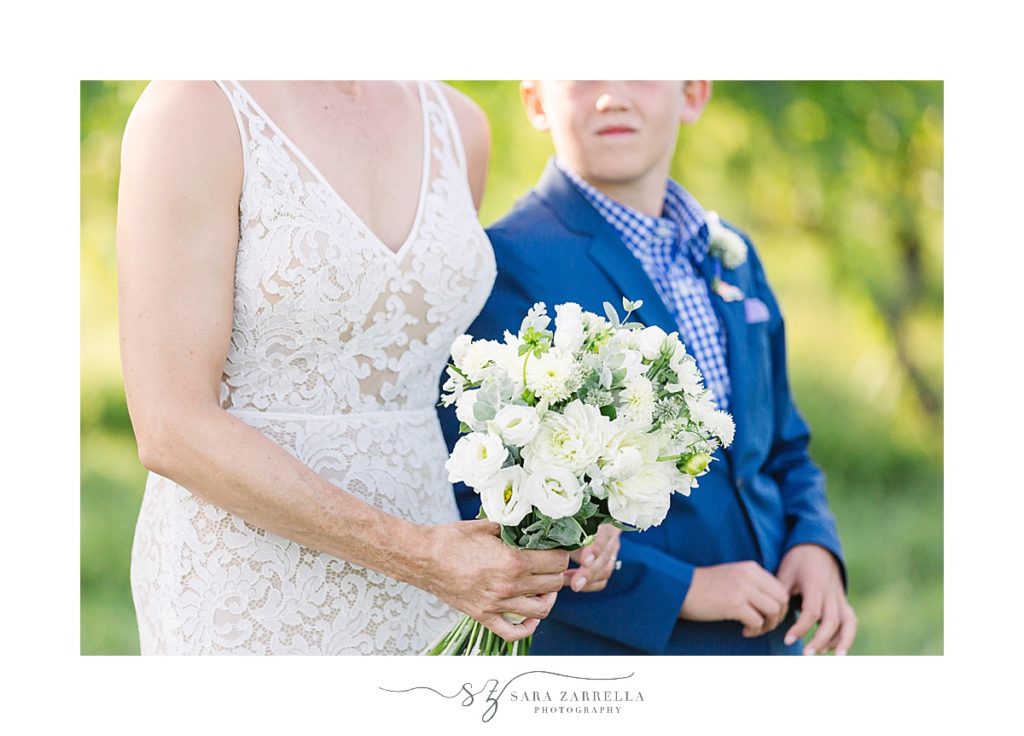 bride's all white bouquet photographed by Sara Zarrella Photography
