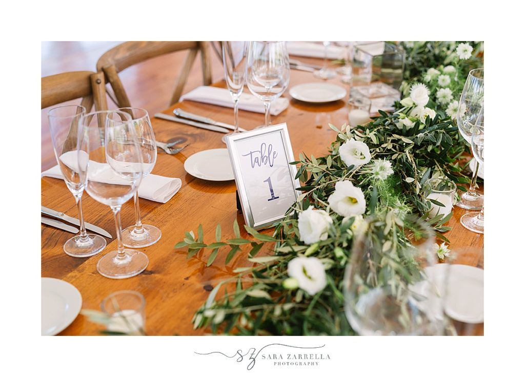 green and ivory florals for wedding reception photographed by Sara Zarrella Photography
