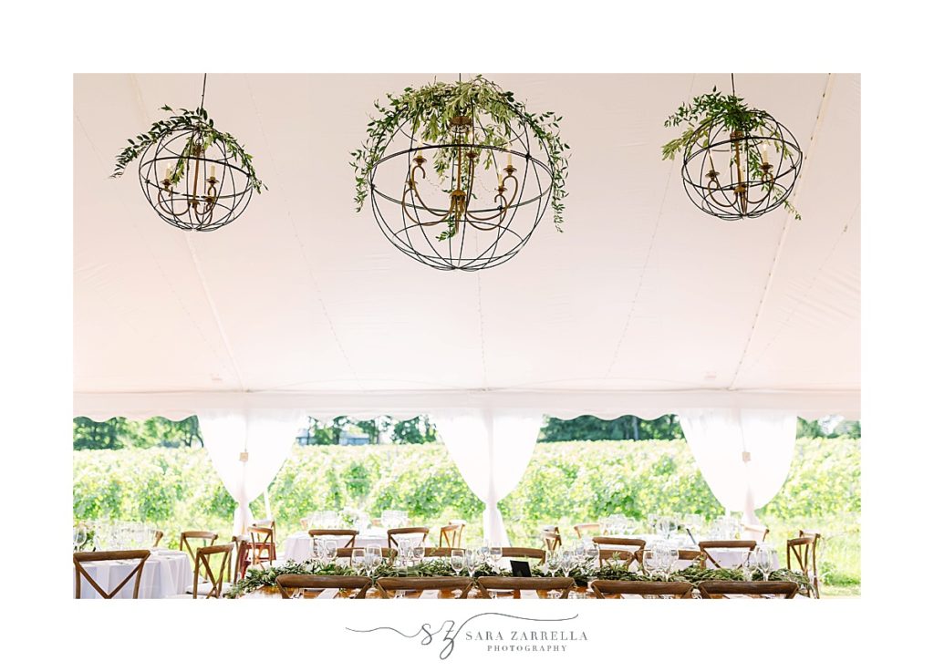tented wedding reception with hanging florals photographed by Sara Zarrella Photography