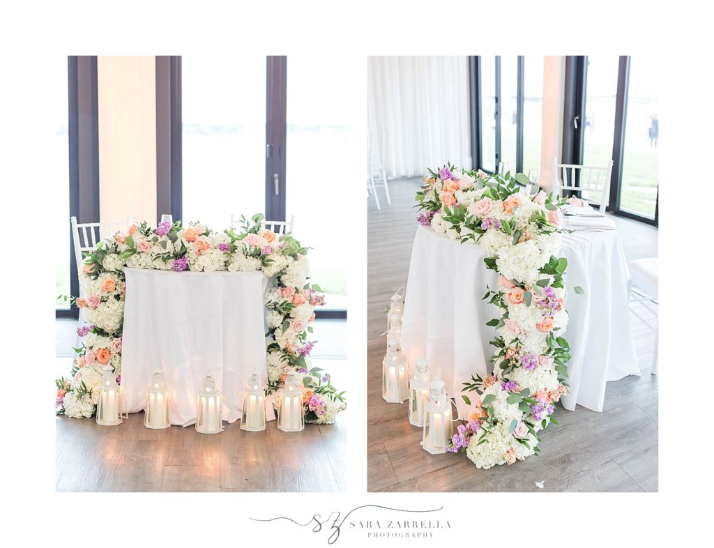 wedding florals along sweetheart table by Sara Zarrella Photography
