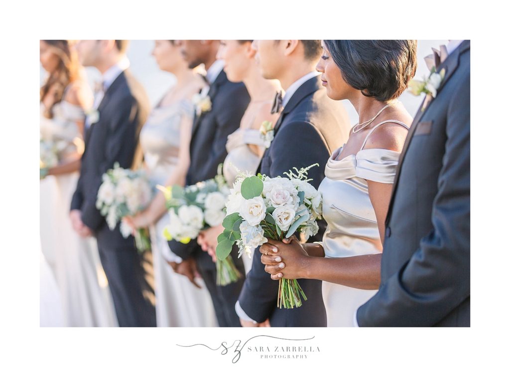 bridal party photographed during ceremony at Belle Mer with Sara Zarrella Photography