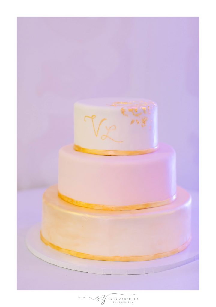 gold and ivory wedding cake by Belle Mer in Newport RI with Sara Zarrella Photography
