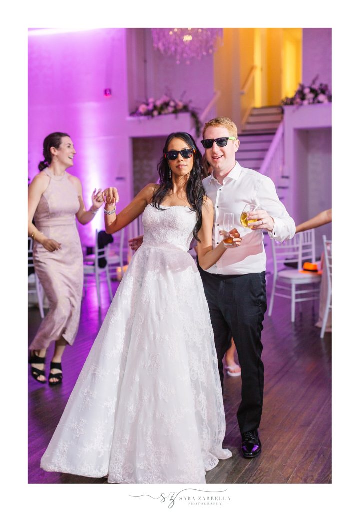 bride and groom enjoy wedding reception at Belle Mer with Sara Zarrella Photography