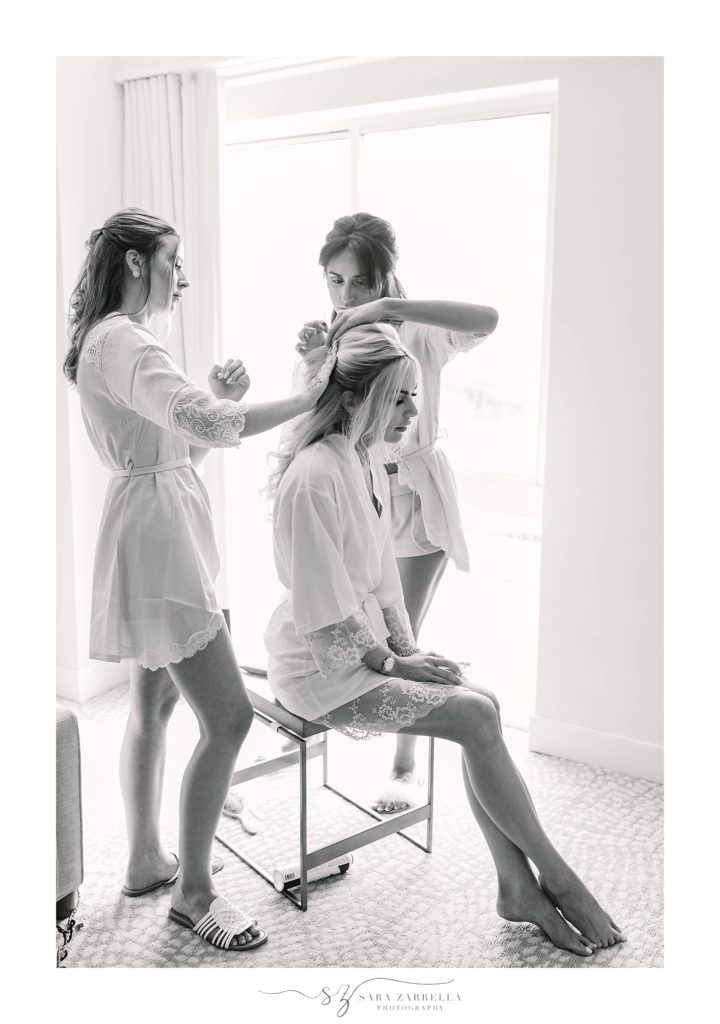 bride prepares for wedding day with beauty team photographed by Sara Zarrella Photography