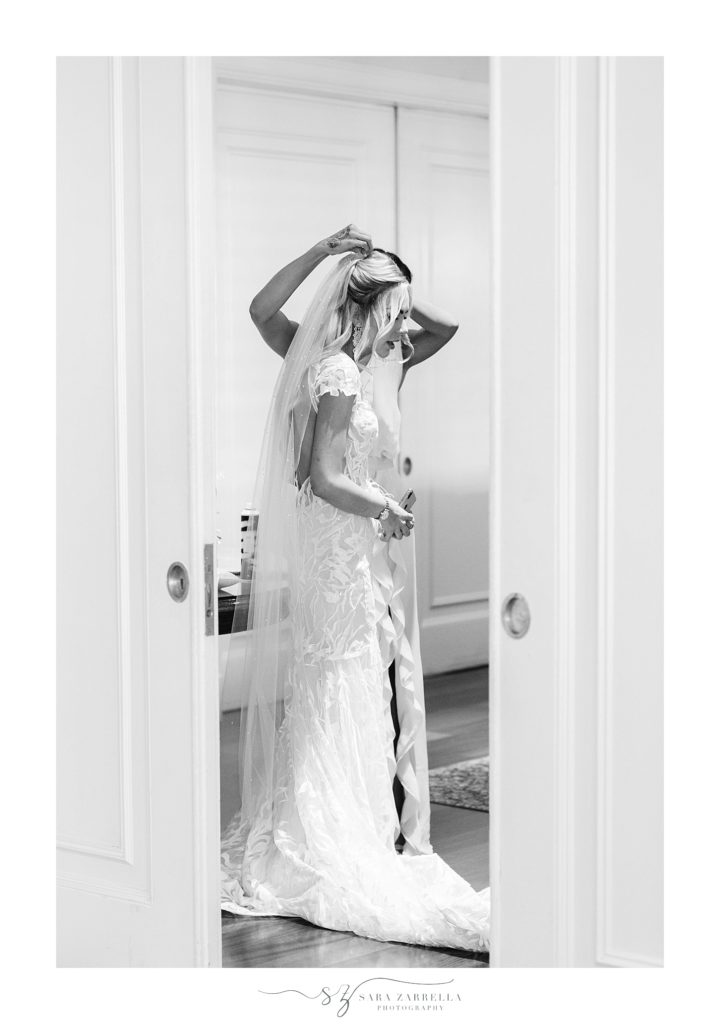 Sara Zarrella Photography photographs bride getting veil on 