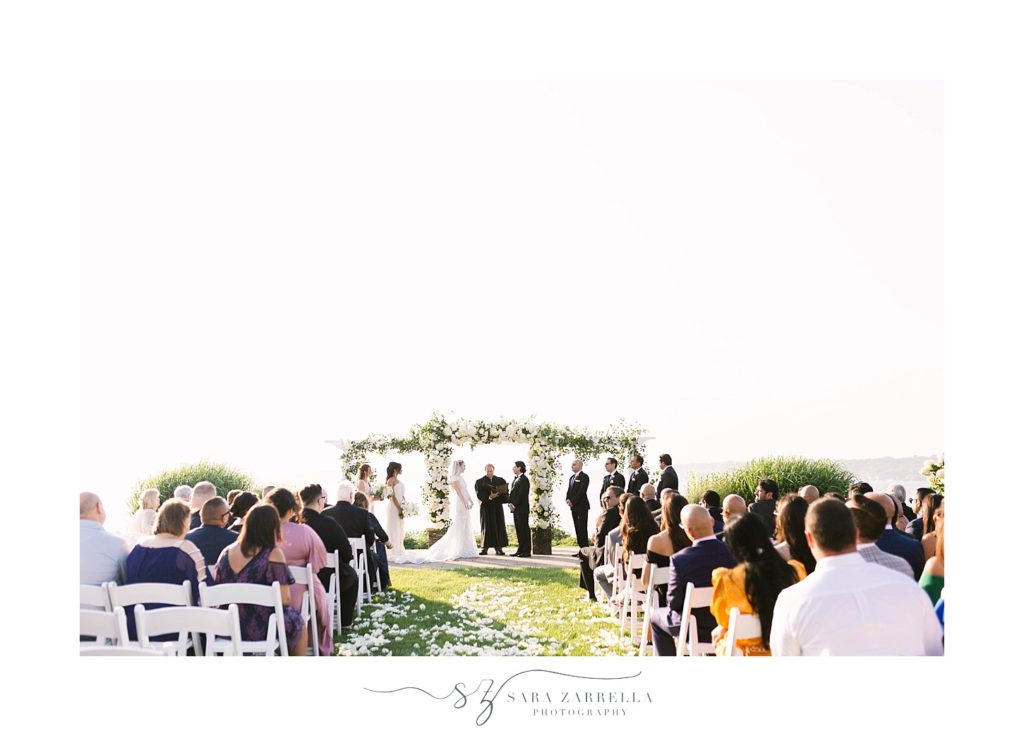 waterfront wedding ceremony photographed by Sara Zarrella Photography