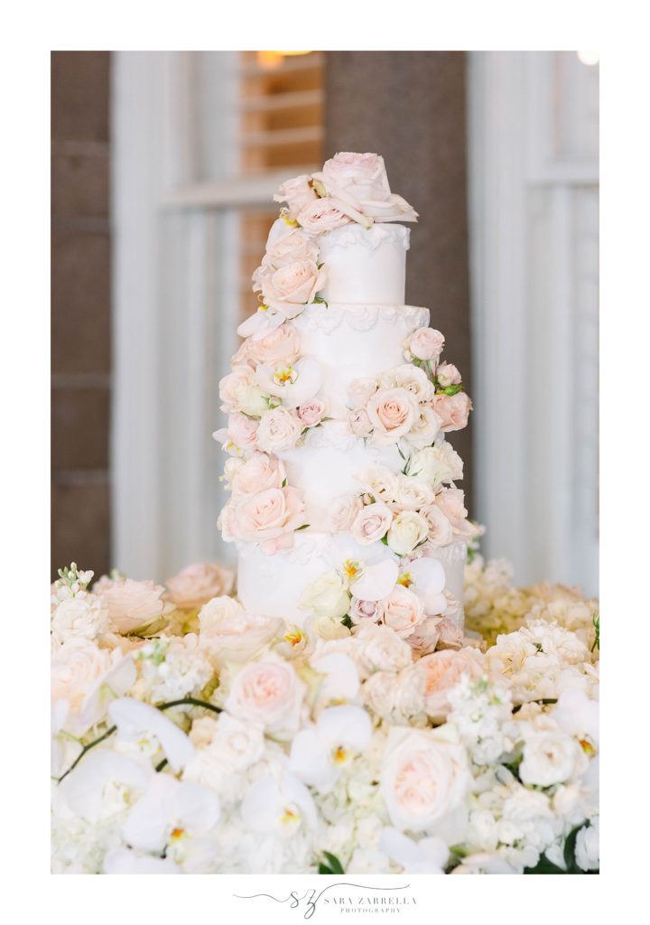 wedding cake with pink and white florals by Sara Zarrella Photography