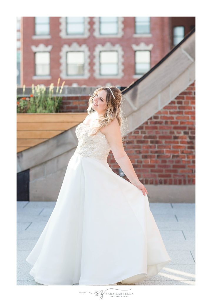 bride twirls dress during wedding portraits with Sara Zarrella Photography