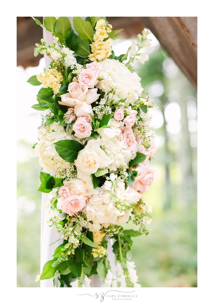 floral display on wedding gazebo in Rhode Island photographed by Sara Zarrella Photography