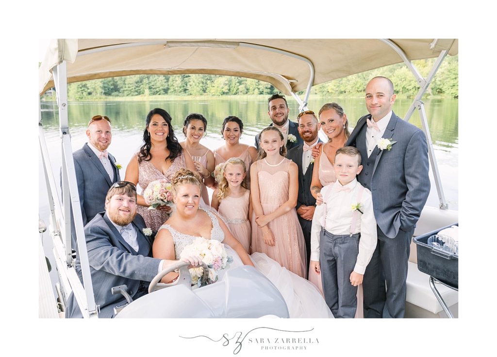 bridal party enjoys boat ride at Crystal Lake Golf Club with Sara Zarrella Photography