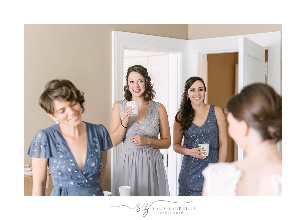 bridesmaids see bride for the first time photographed by Sara Zarrella Photography