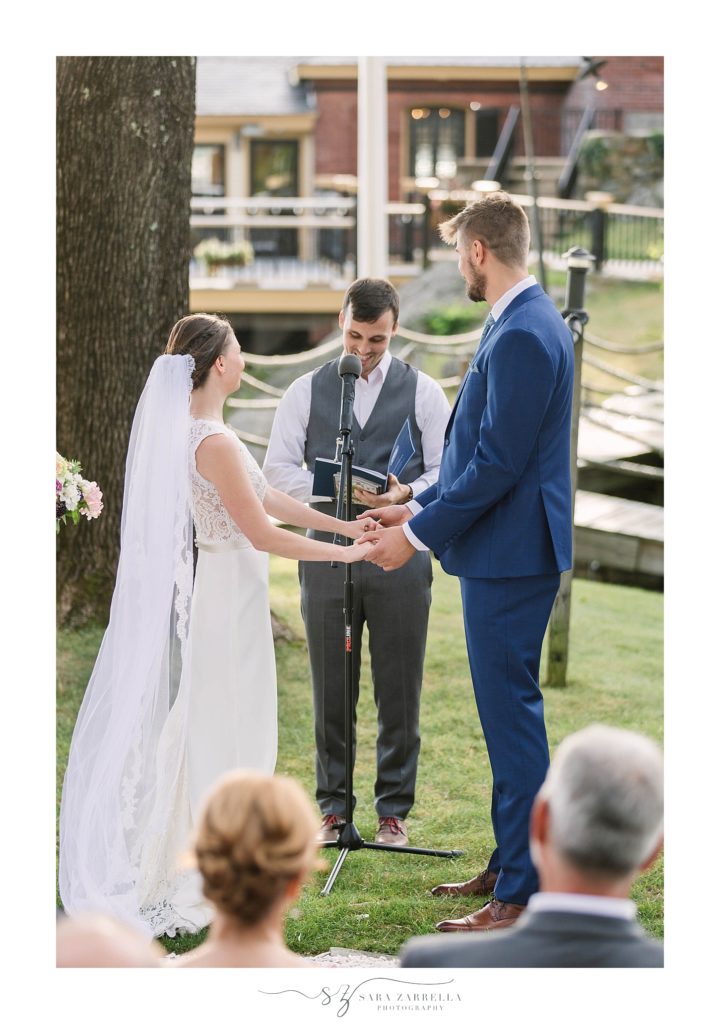 outdoor Squantum Association wedding ceremony photographed by Sara Zarrella Photography