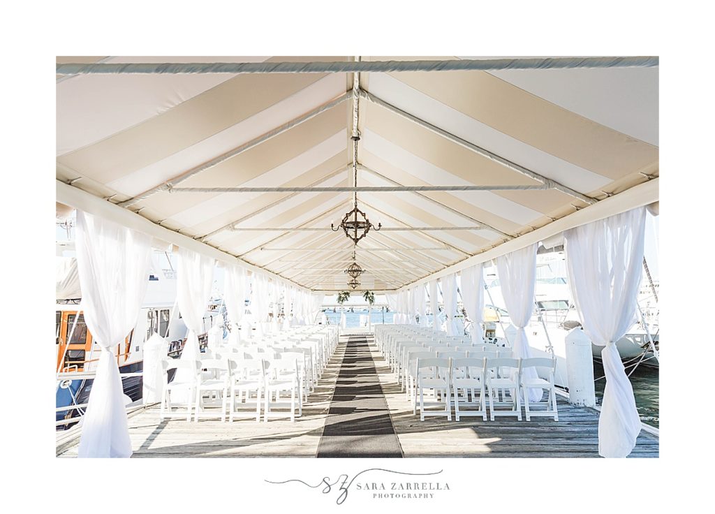 Regatta Place wedding ceremony under tent photographed by Sara Zarrella Photography