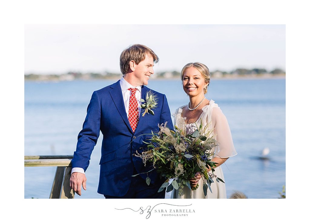 wedding portraits along water at Weekapaug Golf Club with Sara Zarrella Photography