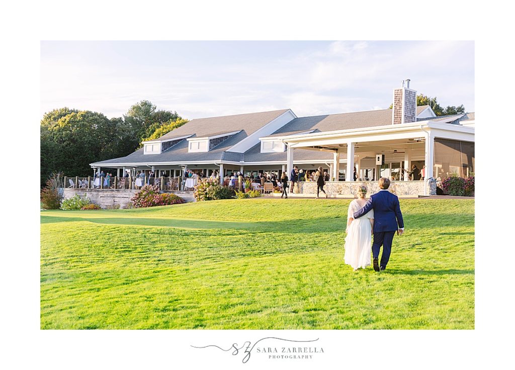 bride and groom walk to wedding reception at Weekapaug Golf Club