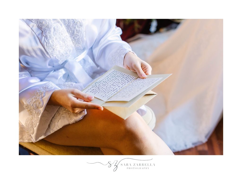 bride reads letter from groom photographed by Sara Zarrella Photography
