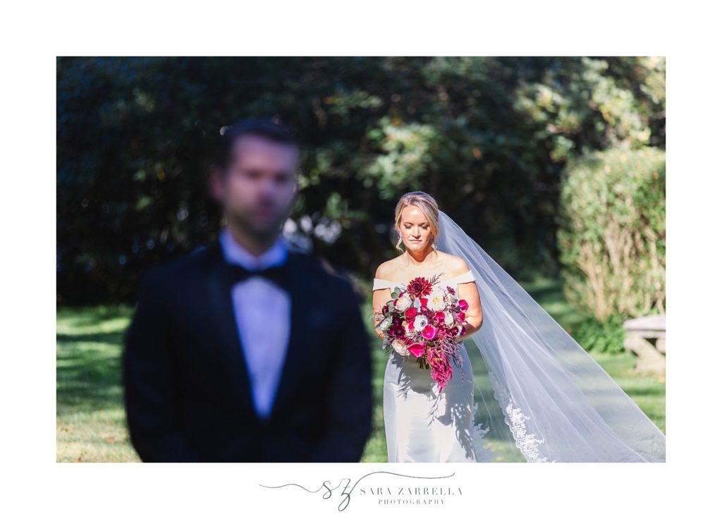 bride approaches groom for first look at Glen Manor House with Sara Zarrella Photography