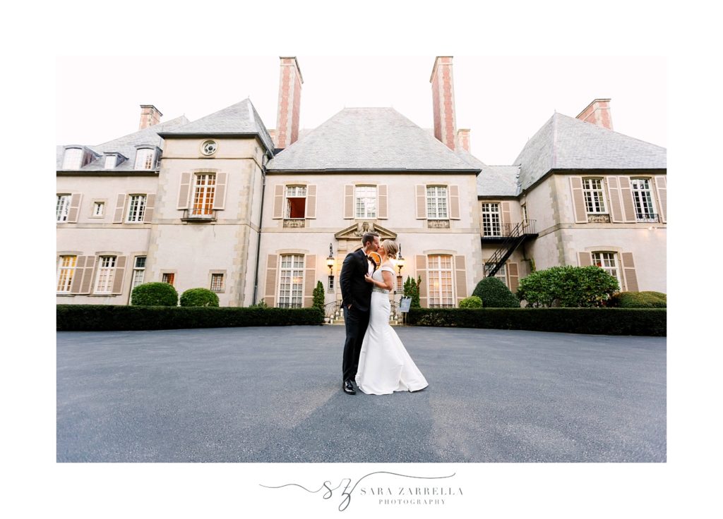 bride and groom kiss outside Glen Manor House with Sara Zarrella Photography