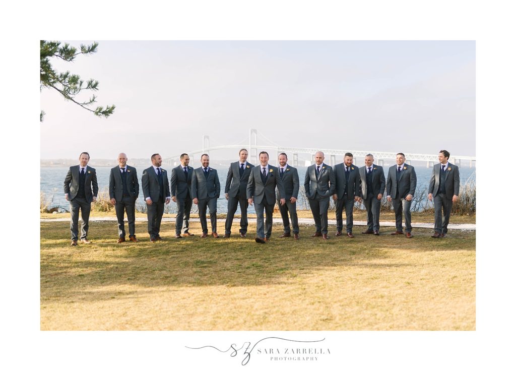 groomsmen pose by Gurney's Newport Resort photographed by Sara Zarrella Photography