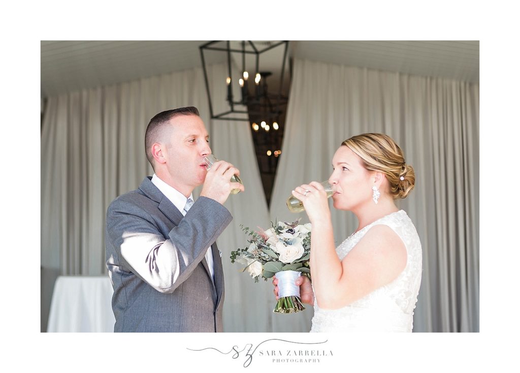 Sara Zarrella Photography captures newlyweds toasting at Newport Beach House