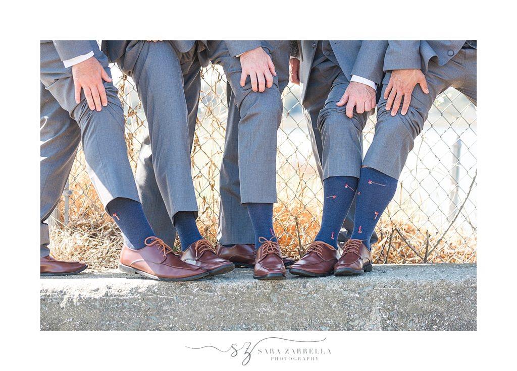 groomsmen show off custom socks at Newport Beach House with Sara Zarrella Photography