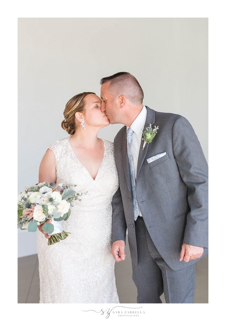 bride and groom kiss for RI wedding photographer Sara Zarrella Photography