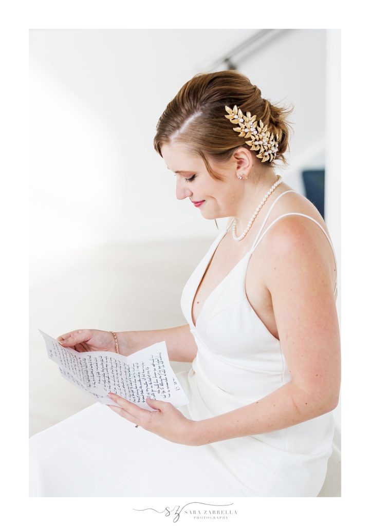 Sara Zarrella Photography captures bride reading letter from groom on wedding day