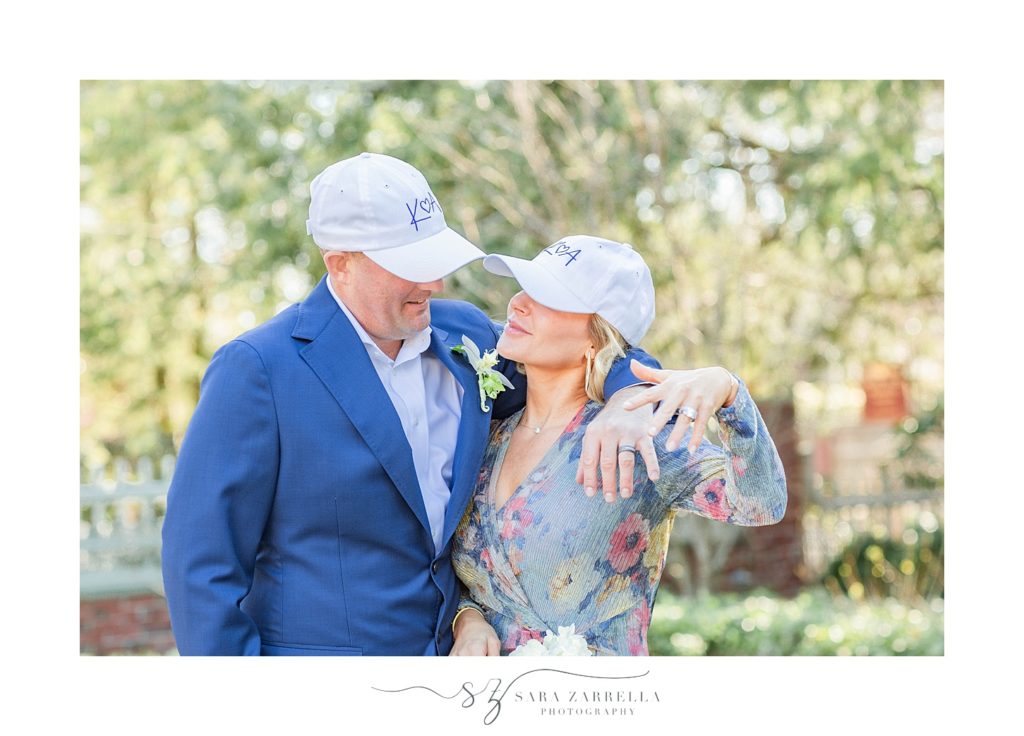 bride and groom wear matching hats during wedding photos with Sara Zarrella Photography