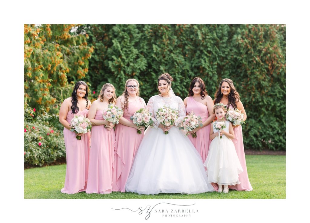 bridesmaids in pink pose for Sara Zarrella Photography
