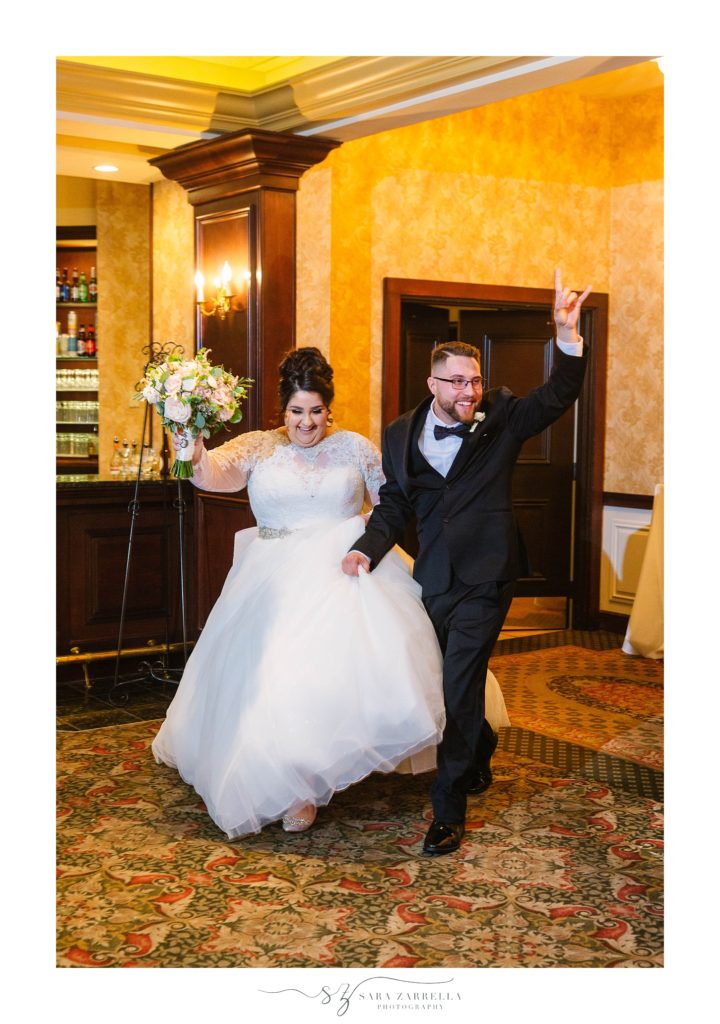Sara Zarrella Photography photographs couple entering wedding reception