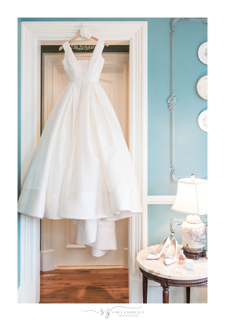 wedding gown hangs in the Chanler at CliffWalk photographed by Sara Zarrella Photography
