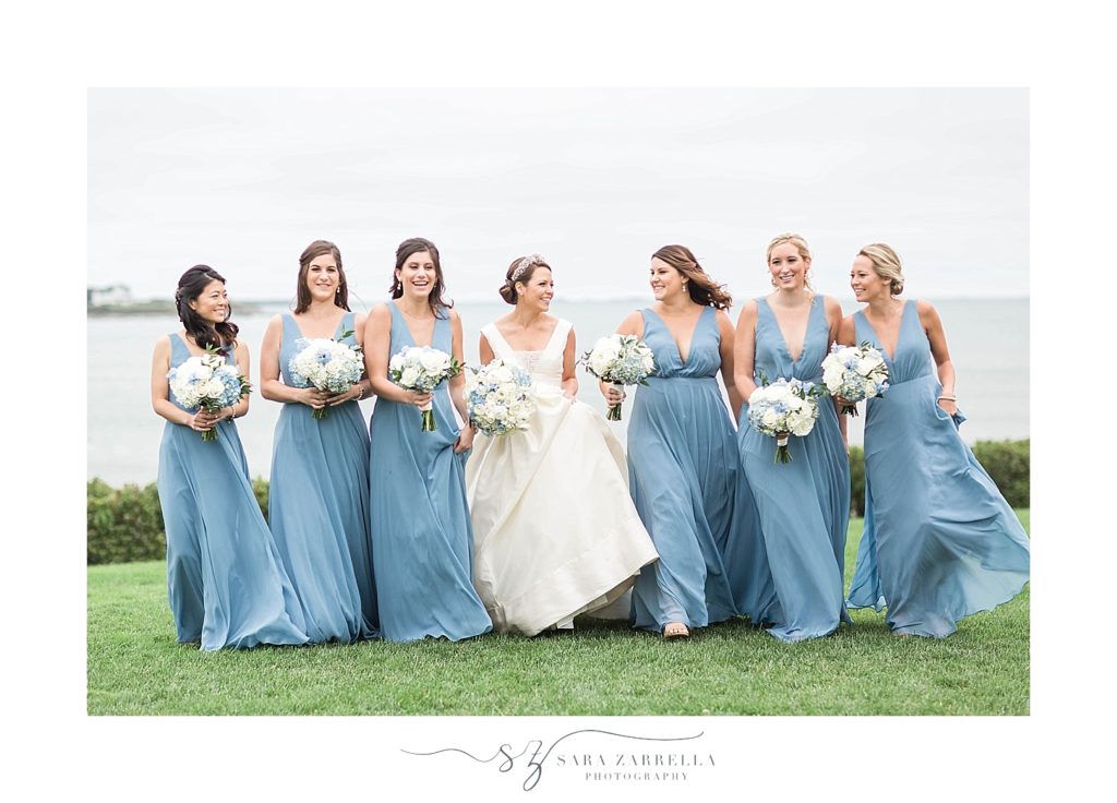 bridesmaids in blue gowns pose for Sara Zarrella Photography